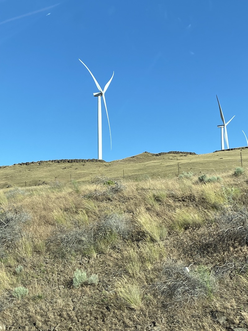 Wind turbine on a hill during the drive