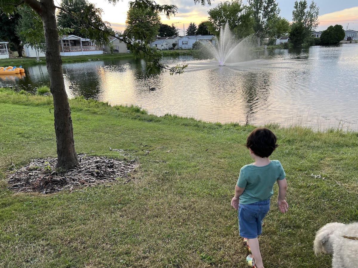 My son walking near a nice pond at our camp spot in London, Ontario