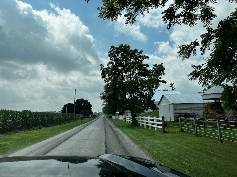 The small road we ended up on while driving through Amish country, with a little farm house on the right