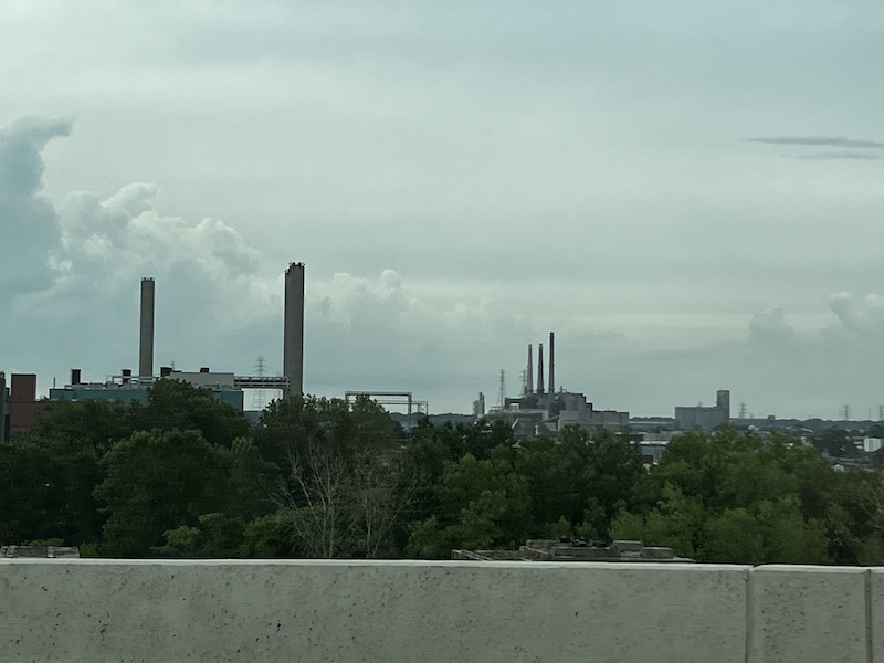 A sort polluted skyline with industrial smoke stacks in Detroit