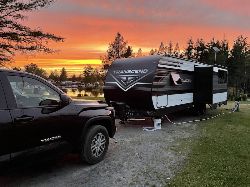 Our campsite in Saguenay with a golden sunset in the background